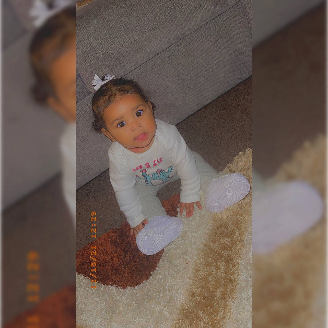 Joy joined the competition — help win amazing prizes! baby, baby_products, baby_toddler_clothing, child, fashion_accessory, flooring, fun, happy, pattern, person, rectangle, room, sitting, sleeve, t_shirt, toddler, wood