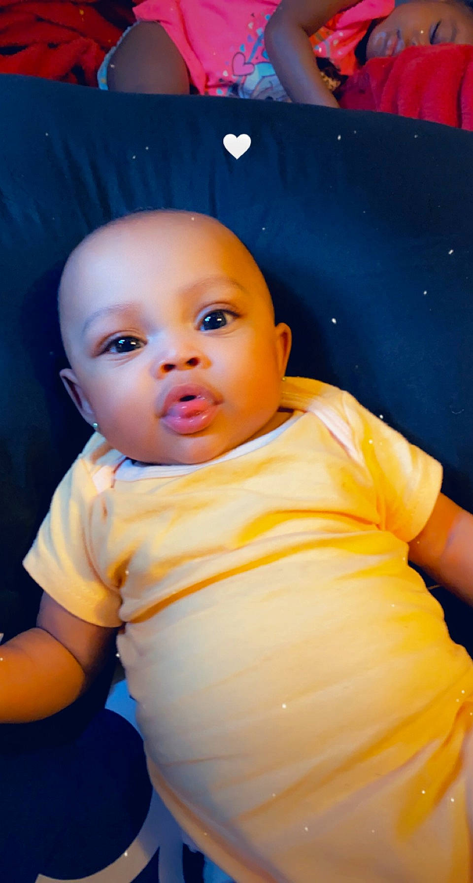 Blessing joined the competition — help win amazing prizes! azure, baby, baby_toddler_clothing, cheek, child, chin, comfort, electric_blue, flash_photography, fun, happy, mouth, neck, nose, orange, person, sitting, skin, sleeve, t_shirt