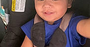 Davidson Flores is registered to the contest to win money with this photo: child, toddler, car_seat, blue_shirt, smile, baby, seatbelt, safety_harness, indoor, cute, happy, person, young_child, infant, car_interior, child_safety, sock, hair, face, portrait