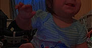 Promiseaity Flores is registered to the contest to win money with this photo: baby, bed, blue_shirt, cartoon, casual, child, curtain, face, furniture, hand, home, indoor, leg, person, playful, room, sitting, smiling, toddler, window