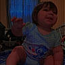 Promiseaity Flores is registered to the contest to win money with this photo: toddler, child, indoor, bed, blue_shirt, cartoon, window, curtain, smiling, person, furniture, home, room, playful, sitting, baby, face, hand, leg, casual