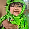 Promiseaity Flores joined the competition — help win amazing prizes! baby, child, costume, green, smiling, face, hand, indoor, person, hood, cute, spider, stitch, clothing, portrait, happy, infant, holding, apparel, closeup