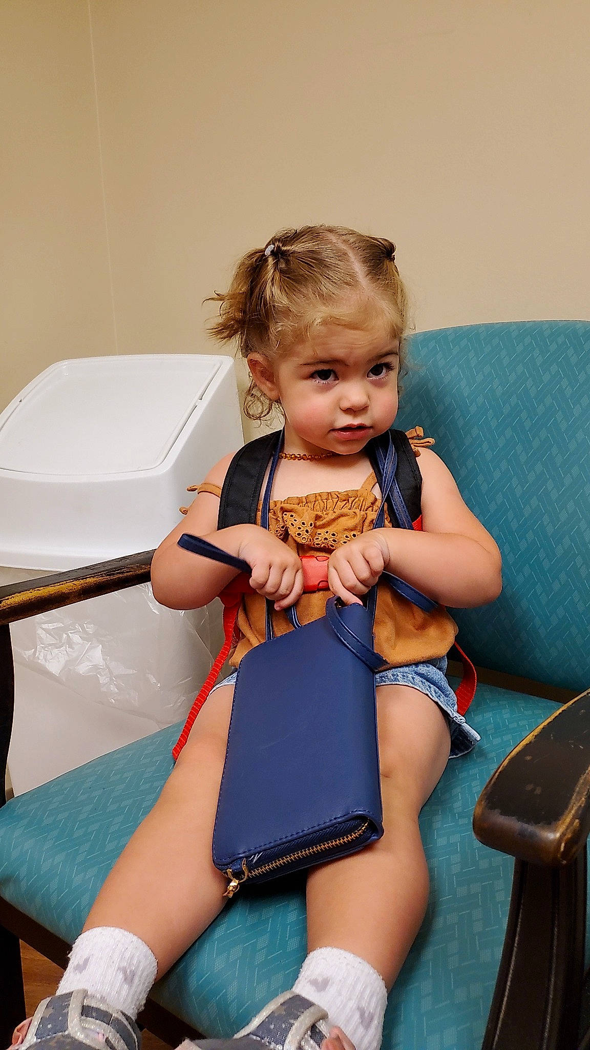 Isabella is registered to the contest to win money with this photo: abdomen, baby, baby_toddler_clothing, blue, child, comfort, electric_blue, happy, human_leg, knee, lap, leg, leisure, nail, neck, person, skin, thigh, thumb, toddler