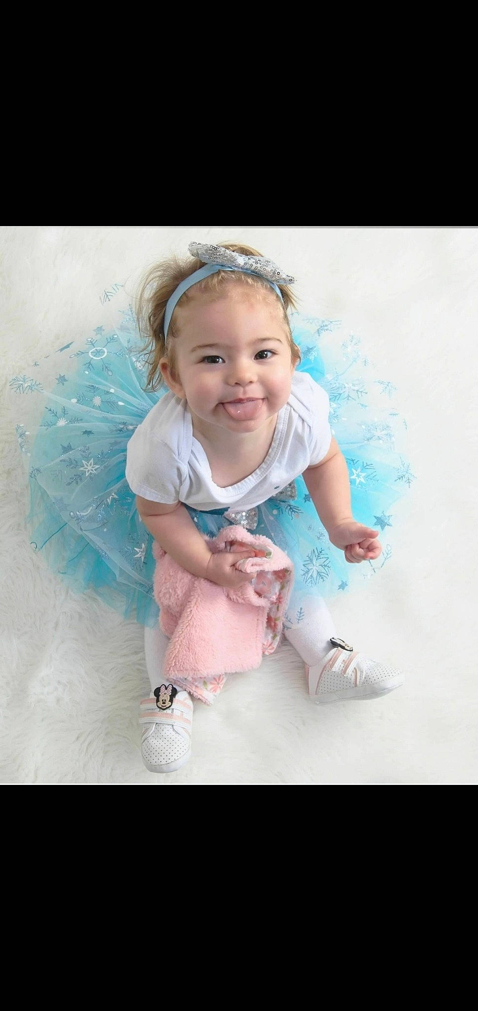 Isabella is registered to the contest to win money with this photo: aqua, baby, baby_toddler_clothing, beauty, child, electric_blue, fashion_accessory, flash_photography, fun, gesture, happy, joy, leisure, magenta, people, people_in_nature, person, pink, product, sleeve