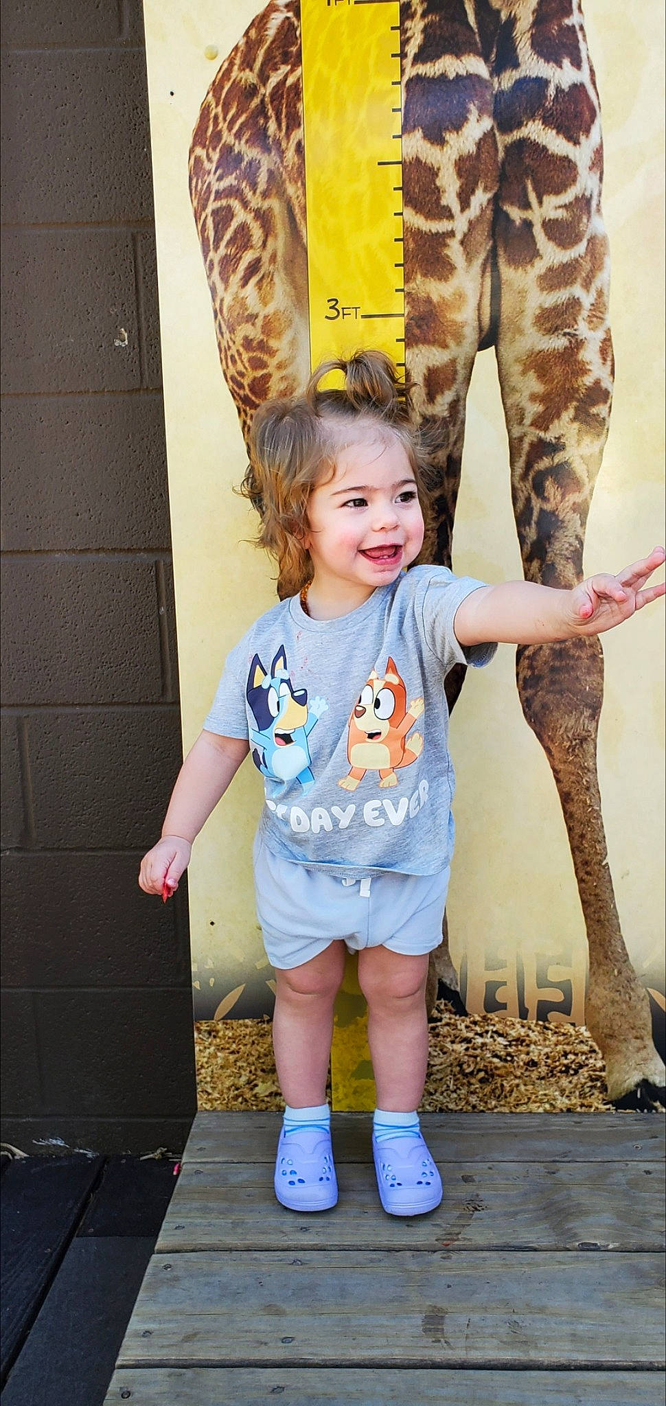 Isabella is registered to the contest to win money with this photo: child, denim, electric_blue, fun, gesture, happy, head, human_leg, joint, joy, leisure, person, pink, play, recreation, smile, sock, standing, t_shirt, thigh