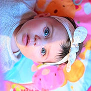 Eva participe au concours pour gagner de l'argent avec cette photo : accessories, baby, bonnet, cap, clothing, coat, earring, face, furniture, happy, hat, head, jewelry, newborn, person, photography, portrait, purple, selfie, smile