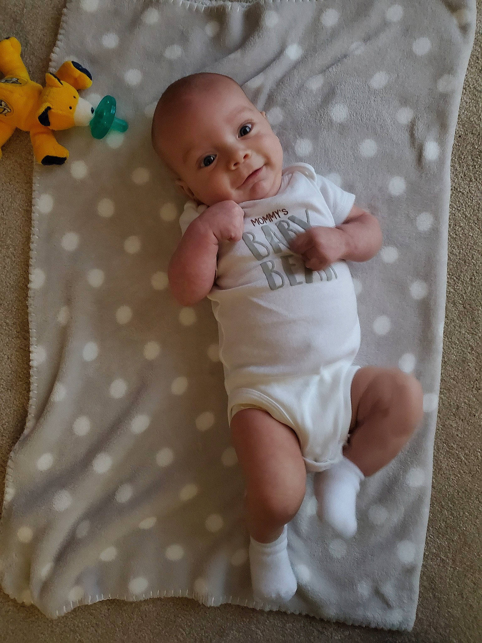 Laine is registered to the contest to win money with this photo: baby, baby_toddler_clothing, bedding, blanket, child, linens, pattern, person, skin, toddler