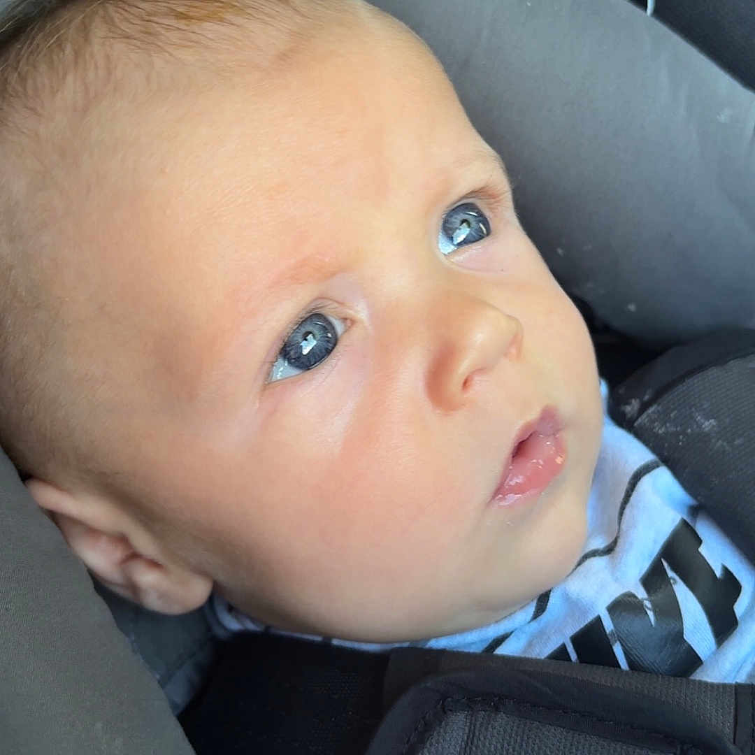 Kase joined the competition — help win amazing prizes! baby, bodypart, car, car_interior, carseat, cushion, face, finger, hand, head, headrest, homedecor, newborn, person, photography, portrait, sleeping, stroller, transportation, vehicle