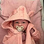 Raya joined the competition — help win amazing prizes! baby, pacifier, pink, hood, robe, blanket, infant, cute, soft, cozy, newborn, face, hands, sleepwear, child, indoors, portrait, resting, clothing, babywear