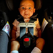 Amelia joined the competition — help win amazing prizes! baby, car_seat, safety_harness, white_socks, pink_shirt, wide_eyes, surprised_expression, infant, child, seatbelt, black_background, head_support, evenflo, sensor_safe, infant_safety, child_safety, baby_clothing, cute, portrait, indoors