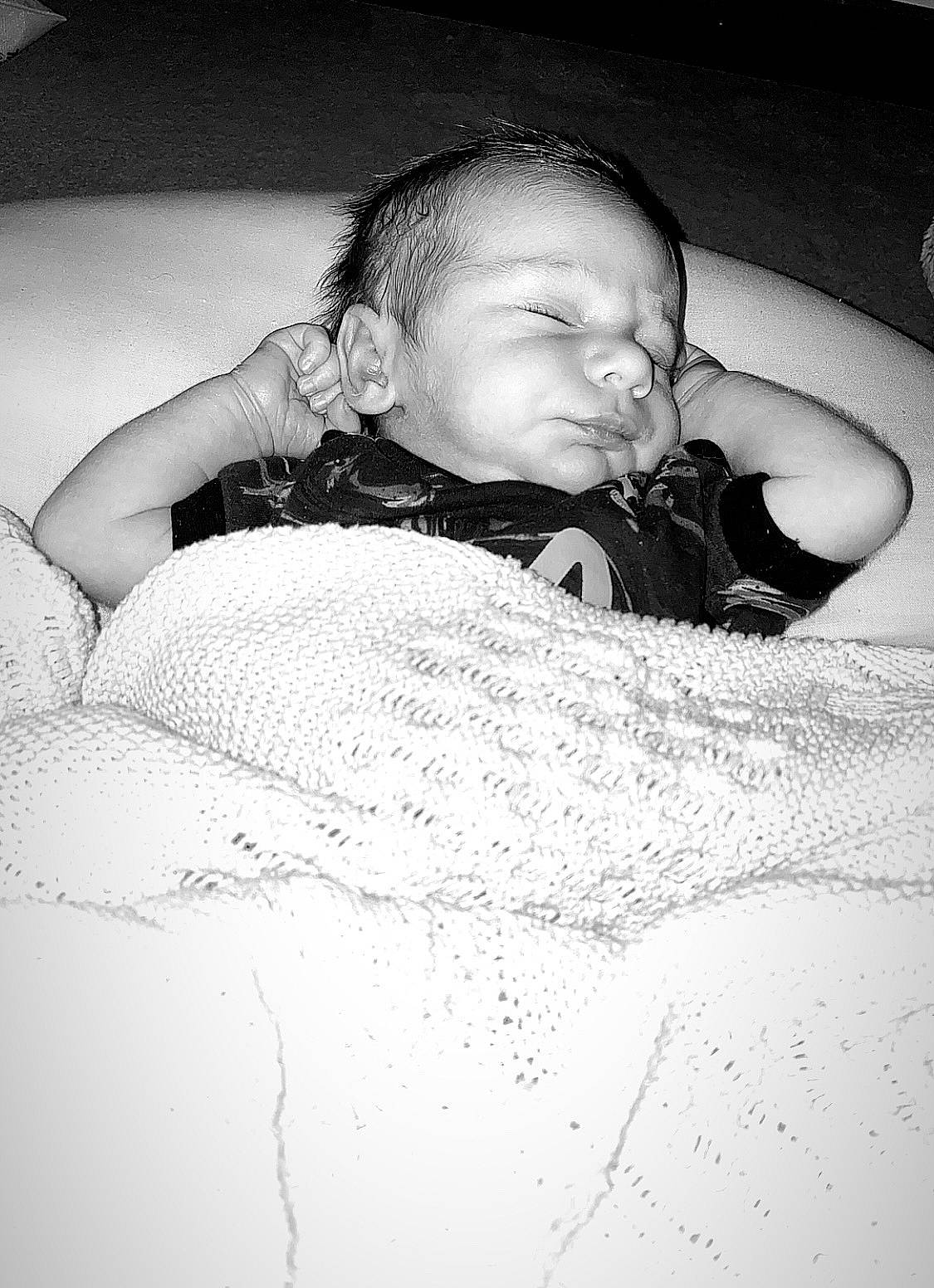 Leo is registered to the contest to win money with this photo: baby, bedding, bedtime, black, black_and_white, child, comfort, eye, eyebrow, flash_photography, fun, hair, happy, human_body, linens, monochrome, monochrome_photography, person, style, tints_and_shades