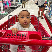 Nyuar joined the competition — help win amazing prizes! baby, shopping_cart, child, store, aisle, clothing, person, retail, curious, grip, footwear, headwear, indoor, shopping, cart, infant, baby_clothes, people, retail_store, floor