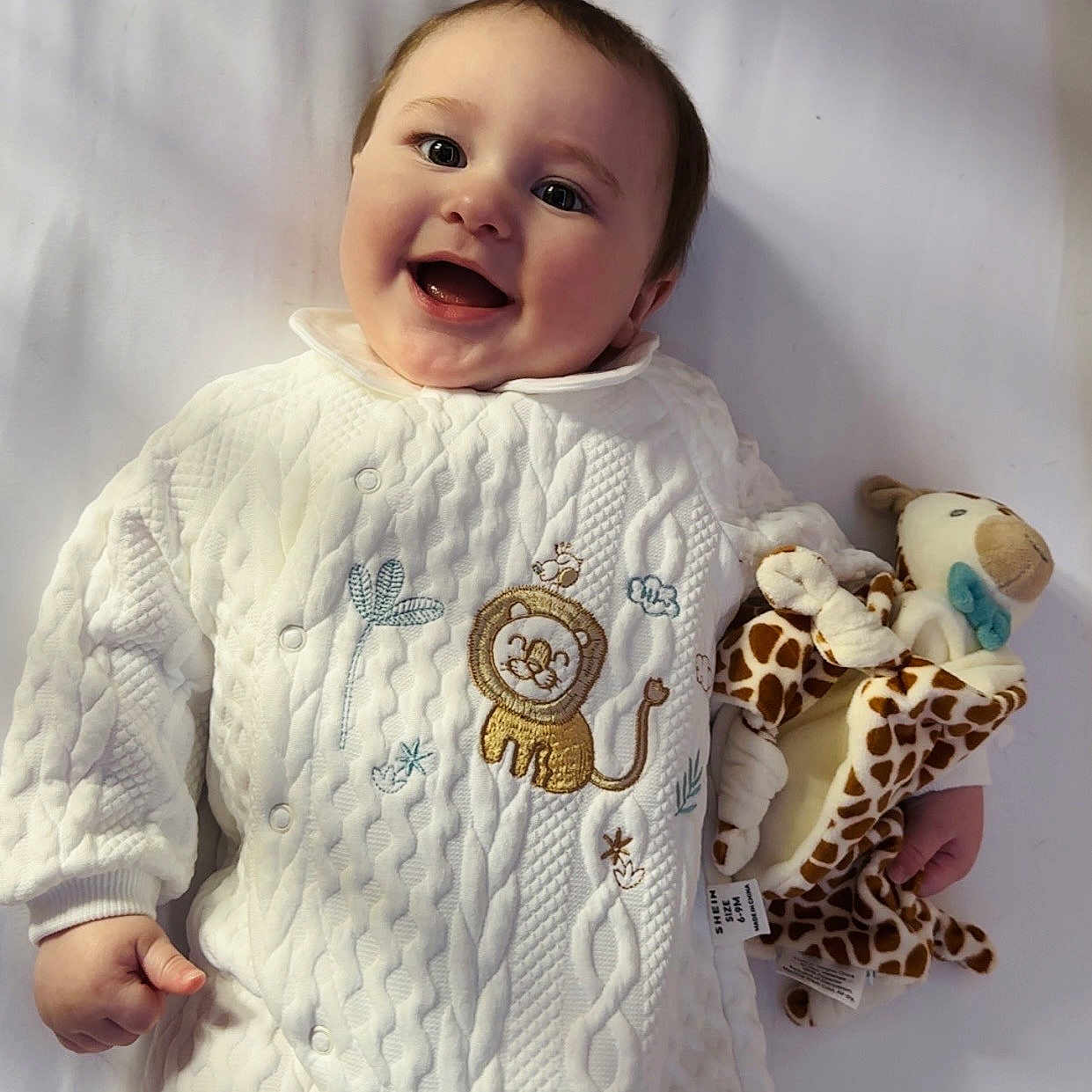 Anthony H is registered to the contest to win money with this photo: baby, babylaughing, bodypart, clothing, dress, face, finger, happy, head, knitwear, laughing, longsleeve, newborn, person, photography, portrait, sleeve, smile, sweater, t_shirt