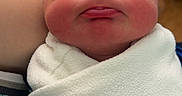 Jonah is registered to the contest to win money with this photo: newborn, baby, sleeping, wrapped, blanket, infant, face, tongue, soft, cozy, arm, person, skin, closeup, indoor, wood, drawer, peaceful, cute, child