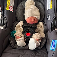 Jonah joined the competition — help win amazing prizes! newborn, baby, car_seat, infant, sleeping, knit_hat, pom_pom, socks, cozy, child, straps, safety, cute, small, peaceful, indoors, fabric, soft, resting, bundle