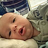 Coleson joined the competition — help win amazing prizes! baby, blanket, blinds, button, chair, closeup, clothing, cute, face, indoors, infant, lying_down, mouth_open, pacifier, person, portrait, sleepwear, soft_light, window, young_child