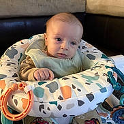 Coleson joined the competition — help win amazing prizes! baby, baby_seat, blue_eyes, child, clothing, comfort, cushion, cute, expression, face, hand, head, indoor, infant, living_room, pants, portrait, skin, sofa, toy