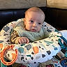 baby, baby_seat, blue_eyes, child, clothing, comfort, cushion, cute, expression, face, hand, head, indoor, infant, living_room, pants, portrait, skin, sofa, toy
