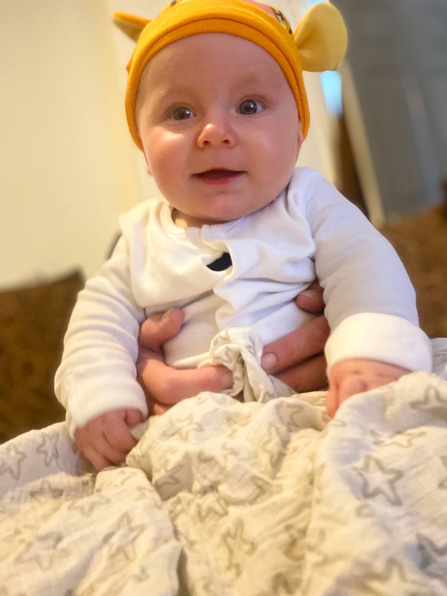 Eric joined the competition — help win amazing prizes! baby, baby_toddler_clothing, cheek, child, chin, comfort, eye, face, fun, gesture, happy, headgear, headwear, linens, pattern, person, sitting, skin, sleeve, smile