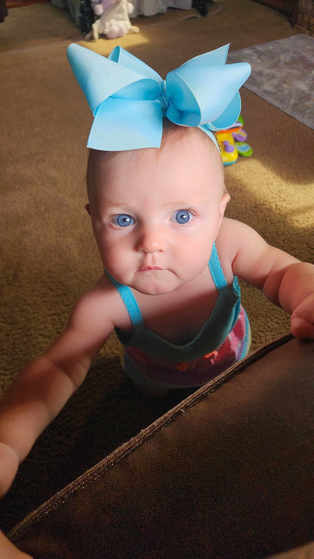 Brynlee joined the competition — help win amazing prizes! accessories, art, baby, bodypart, clothing, costume, couch, dress, face, finger, furniture, hand, hat, head, origami, paper, partyhat, person, photography, portrait
