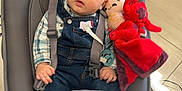 Soen participe au concours pour gagner de l'argent avec cette photo : baby, clothing, coat, couch, cushion, face, footwear, furniture, head, homedecor, hosiery, jacket, jeans, pants, person, photography, portrait, shoe, sitting, sock