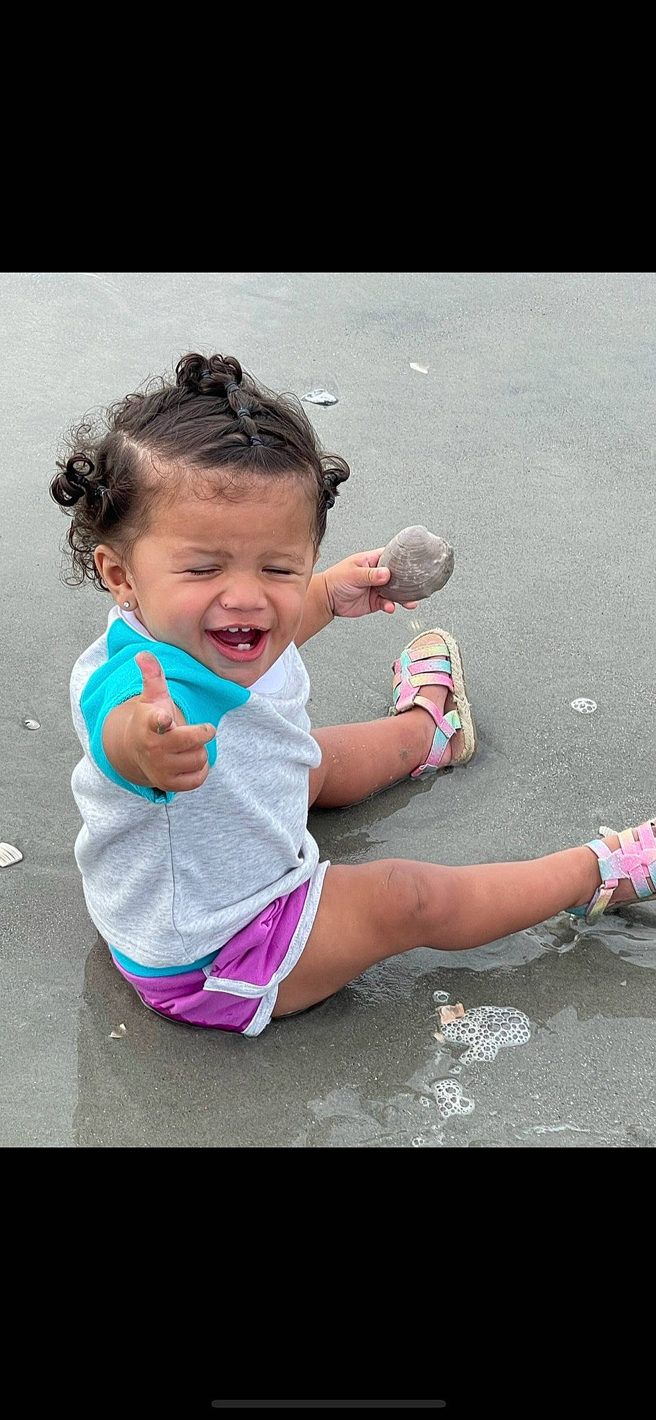 Annalia is registered to the contest to win money with this photo: asphalt, baby_toddler_clothing, child, facial_expression, finger, fun, gesture, grass, hand, happy, human_leg, leisure, people_in_nature, person, pink, play, recreation, smile, sneakers, toddler