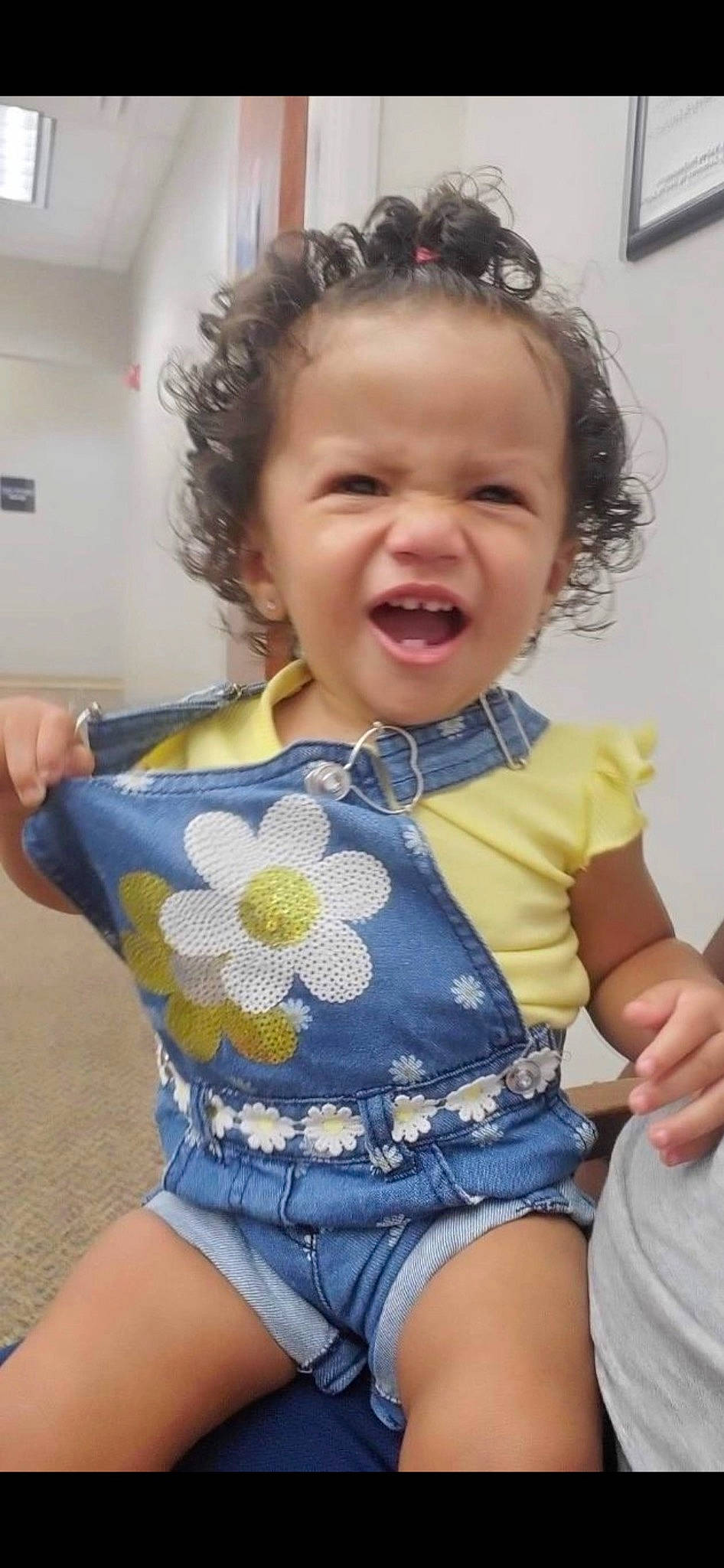 Annalia is registered to the contest to win money with this photo: baby_toddler_clothing, cheek, eye, face, gesture, hair, hairstyle, happy, head, human_body, iris, mouth, neck, organ, person, plant, skin, sleeve, standing, thigh