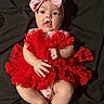 Athena joined the competition — help win amazing prizes! baby, infant, child, portrait, red_dress, pink_bow, headband, ruffles, fashion, sitting, lying_down, indoors, black_blanket, wide_eyed, open_mouth, smiling, hands, feet, colorful_clothing, photography