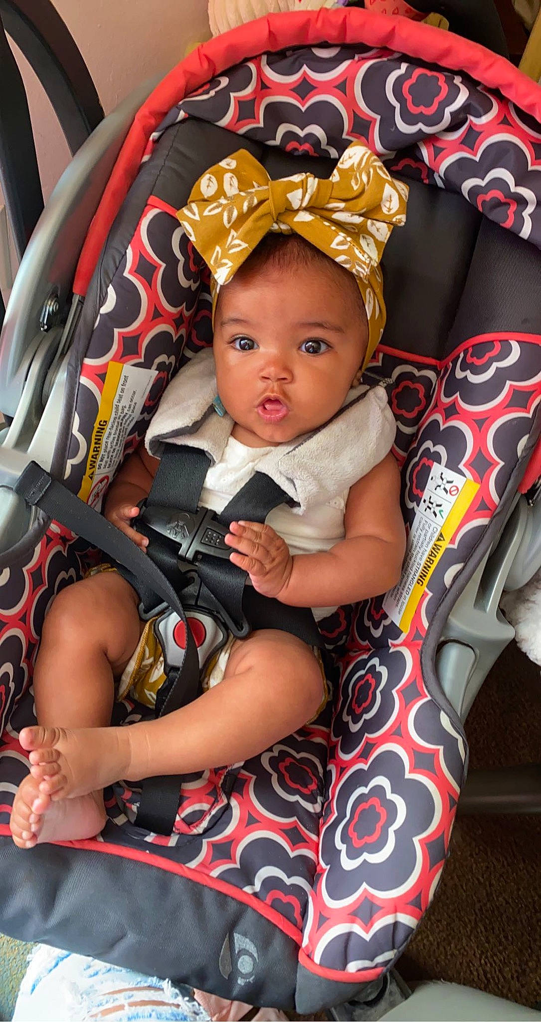 Dalylah Lahrey is registered to the contest to win money with this photo: baby, baby_products, baby_toddler_clothing, car_seat, chair, child, comfort, costume_hat, event, fashion_accessory, fun, hairstyle, happy, hat, iris, jewellery, lap, person, sitting, toddler