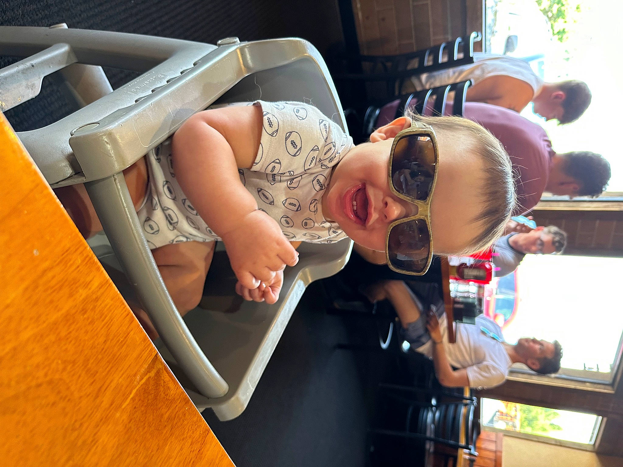 Karson is registered to the contest to win money with this photo: automotive_design, child, comfort, elbow, event, eyewear, finger, fun, goggles, hat, human_leg, leisure, muscle, person, public_transport, room, sunglasses, t_shirt, thigh, vision_care