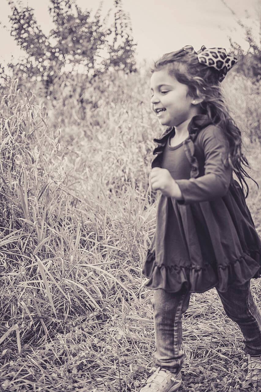 Addalyn is registered to the contest to win money with this photo: black_and_white, child, child_model, dress, grass, grass_family, headgear, joy, monochrome, monochrome_photography, people_in_nature, person, photograph, photography, plant, portrait, retro_style, smile, snapshot, standing