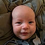 Ashton joined the competition — help win amazing prizes! baby, infant, smiling, face, blanket, clothing, camouflage, cozy, closeup, cute, child, newborn, hand, portrait, soft, warm, indoors, young, expression, comfort