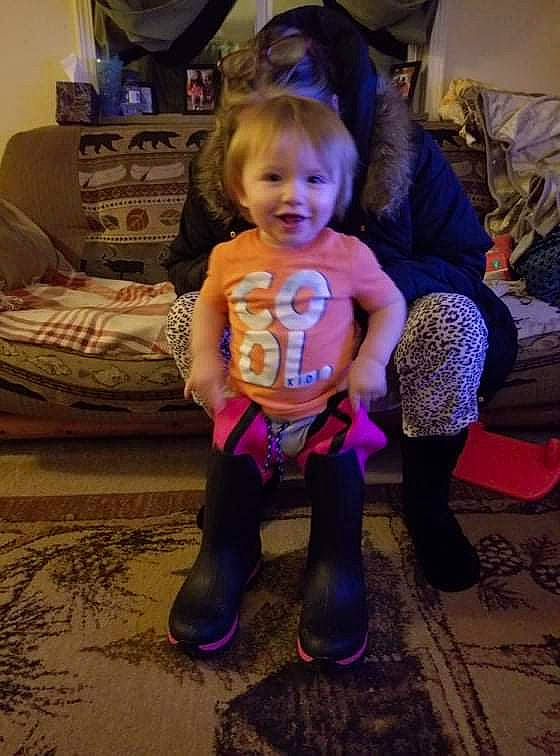 Sebastian is registered to the contest to win money with this photo: blond, child, couch, event, face, floor, flooring, fun, head, human_leg, joy, knee, lap, leg, person, picture_frame, purple, sitting, smile, t_shirt