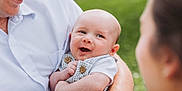 Waylon joined the competition — help win amazing prizes! baby, smiling, adult, holding, outdoor, grass, happy, portrait, closeup, cute, infant, family, love, people, skin, clothing, watching, arm, button, watch