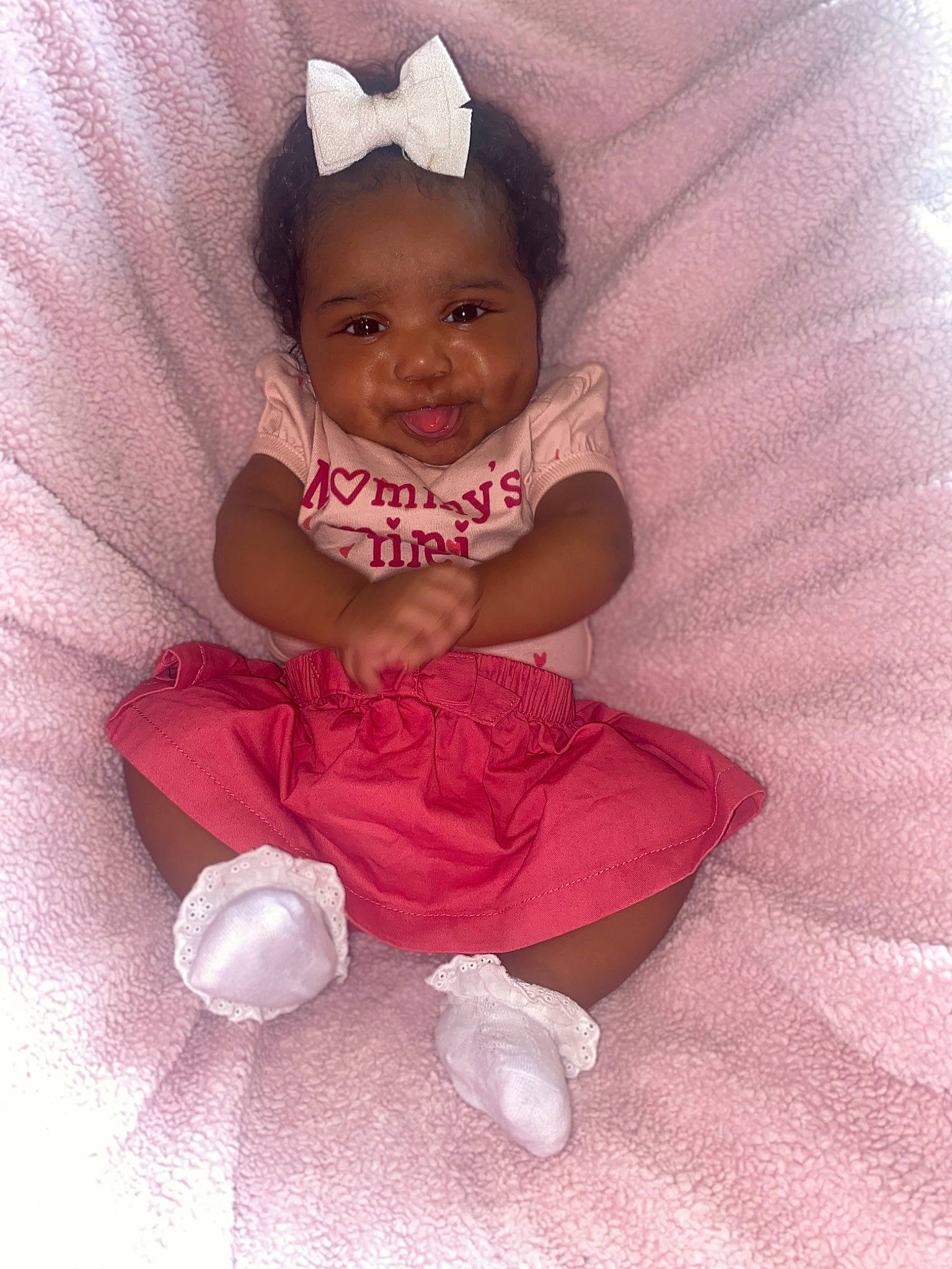 Malani joined the competition — help win amazing prizes! arm, baby, baby_toddler_clothing, cheek, child, comfort, fun, hand, happy, head, magenta, person, petal, pink, purple, sitting, sleeve, smile, sock, textile