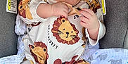 Percy is registered to the contest to win money with this photo: baby, car, clothing, cushion, cutlery, face, furniture, happy, head, homedecor, newborn, pajamas, person, photography, portrait, sitting, smile, spoon, transportation, vehicle