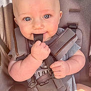Percy is registered to the contest to win money with this photo: baby, infant, car_seat, child, cute, face, hand, straps, grip, smile, eyes, skin, clothing, seatbelt, safety, young_child, portrait, indoor, closeup, adorable