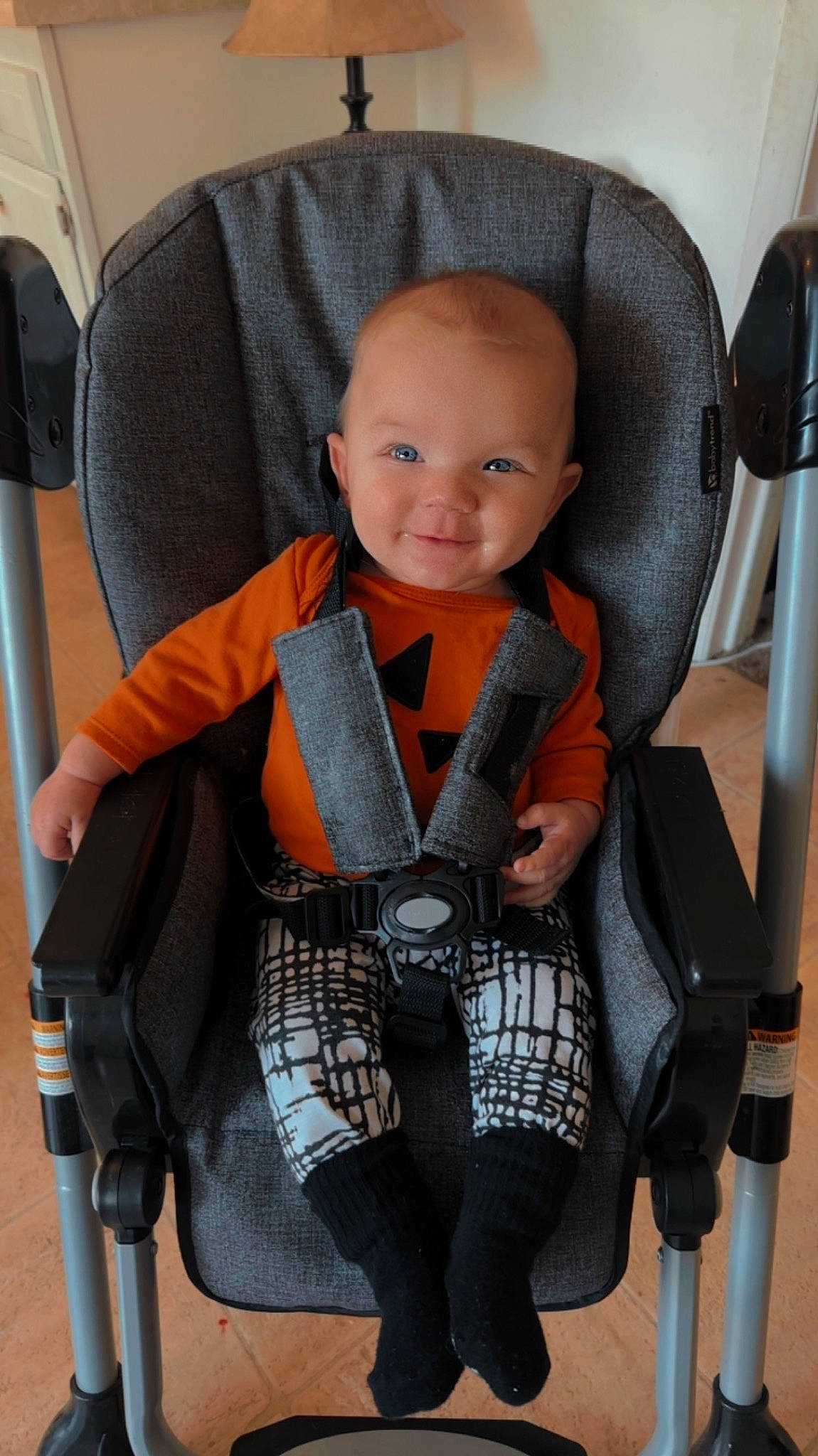 Percy is registered to the contest to win money with this photo: arm, auto_part, baby, baby_carriage, baby_products, baby_toddler_clothing, car_seat, chair, comfort, furniture, head, human_body, knee, leg, person, product, seat_belt, sitting, sleeve, smile