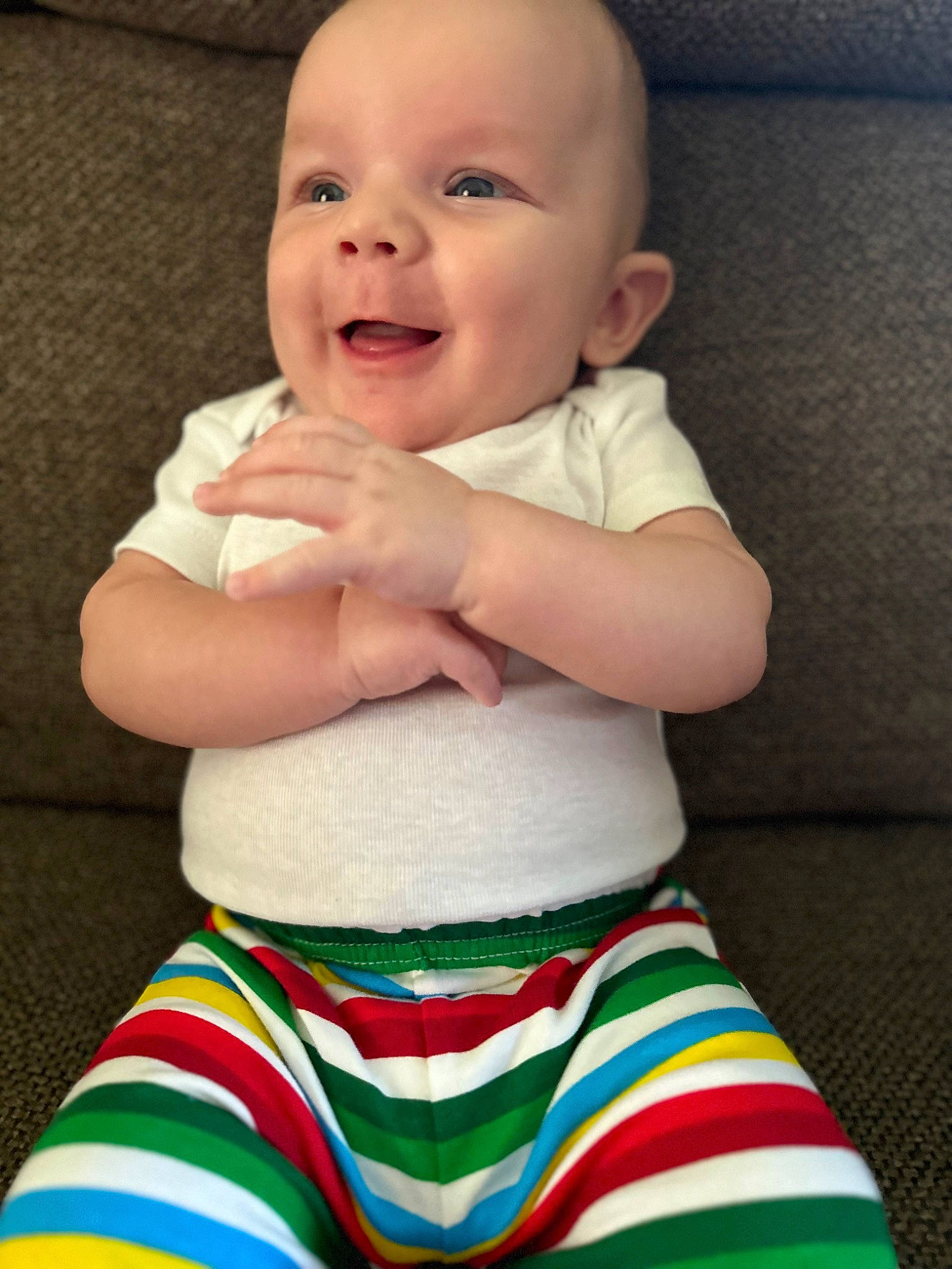 Percy is registered to the contest to win money with this photo: active_pants, arm, baby, baby_toddler_clothing, clothing, dress, eye, finger, hand, happy, head, human_body, person, skin, sleeve, smile, standing, t_shirt, thigh, toddler
