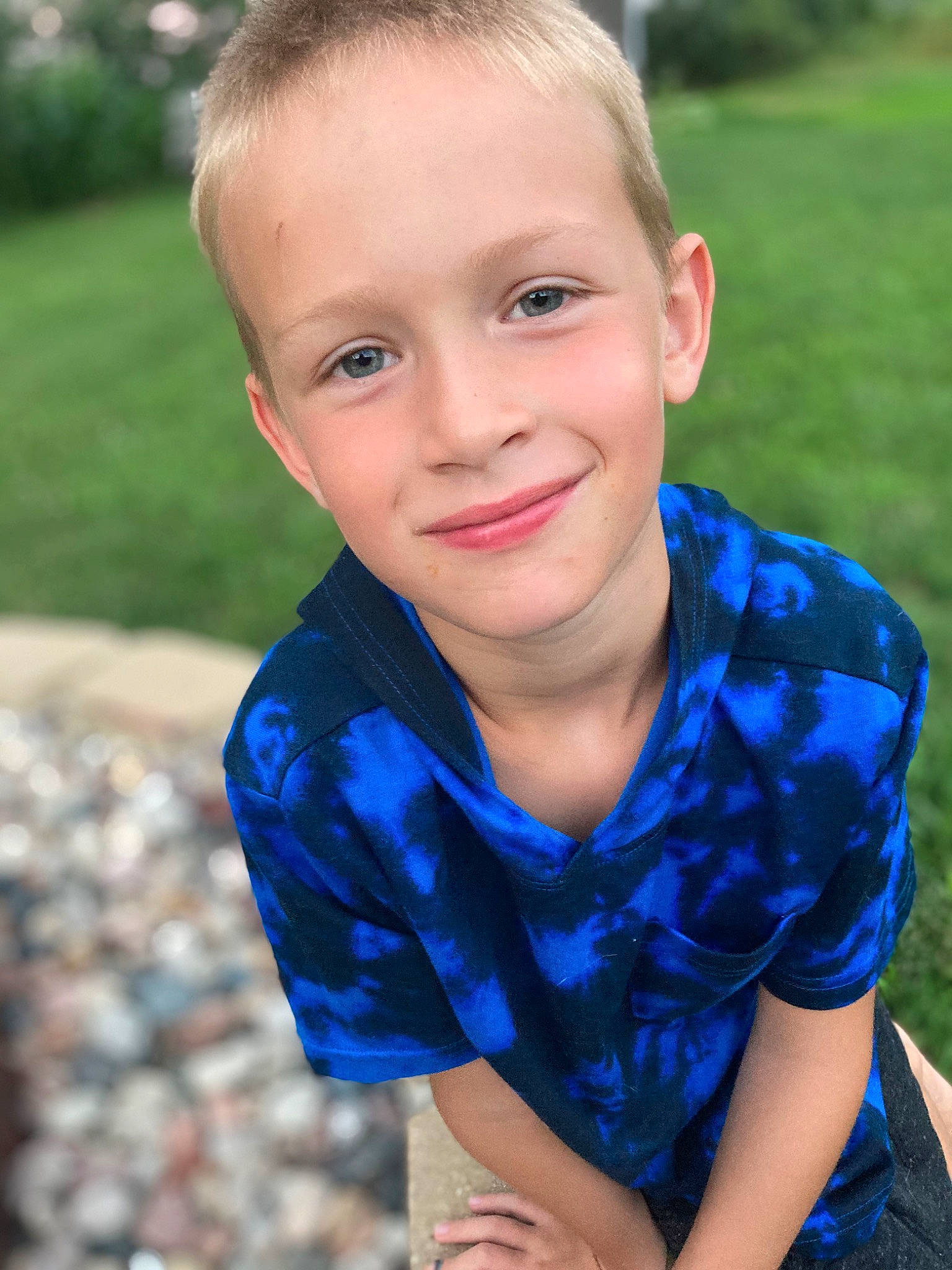 Parker is registered to the contest to win money with this photo: blond, blue, child, close_up, electric_blue, eye, flash_photography, formal_wear, fun, grass, hair, hairstyle, happy, head, iris, joy, leisure, neck, people_in_nature, person