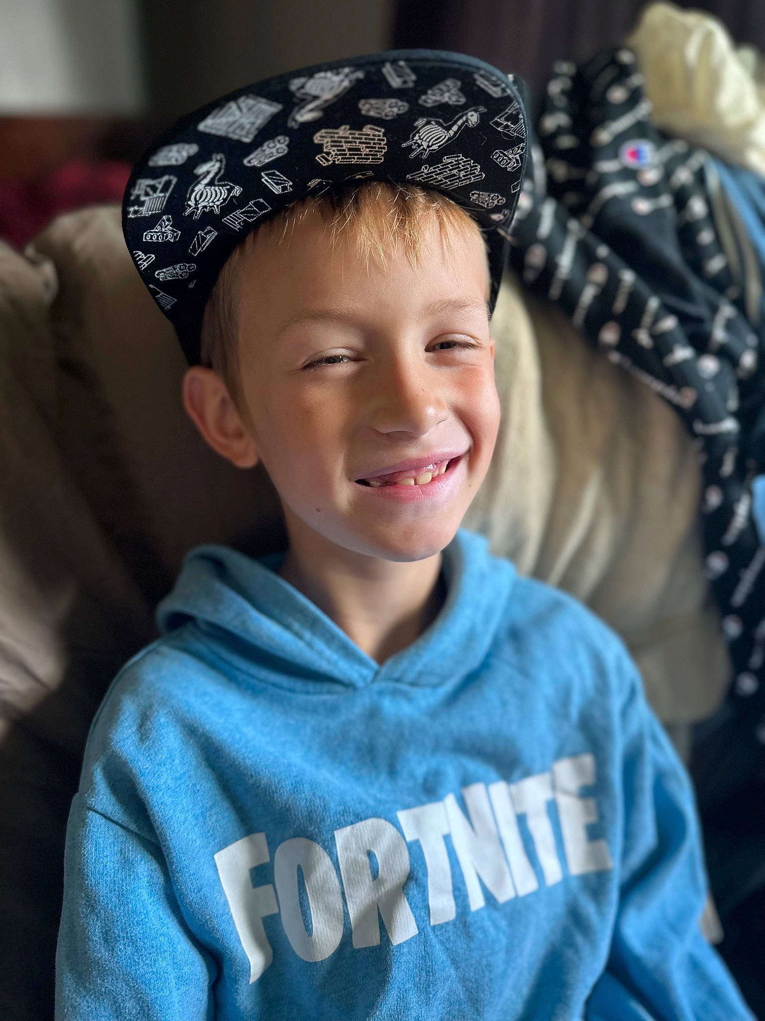 Parker is registered to the contest to win money with this photo: cap, child, chin, cool, electric_blue, eye, eyebrow, face, flash_photography, forehead, fun, happy, head, headgear, joy, neck, outerwear, person, sleeve, smile