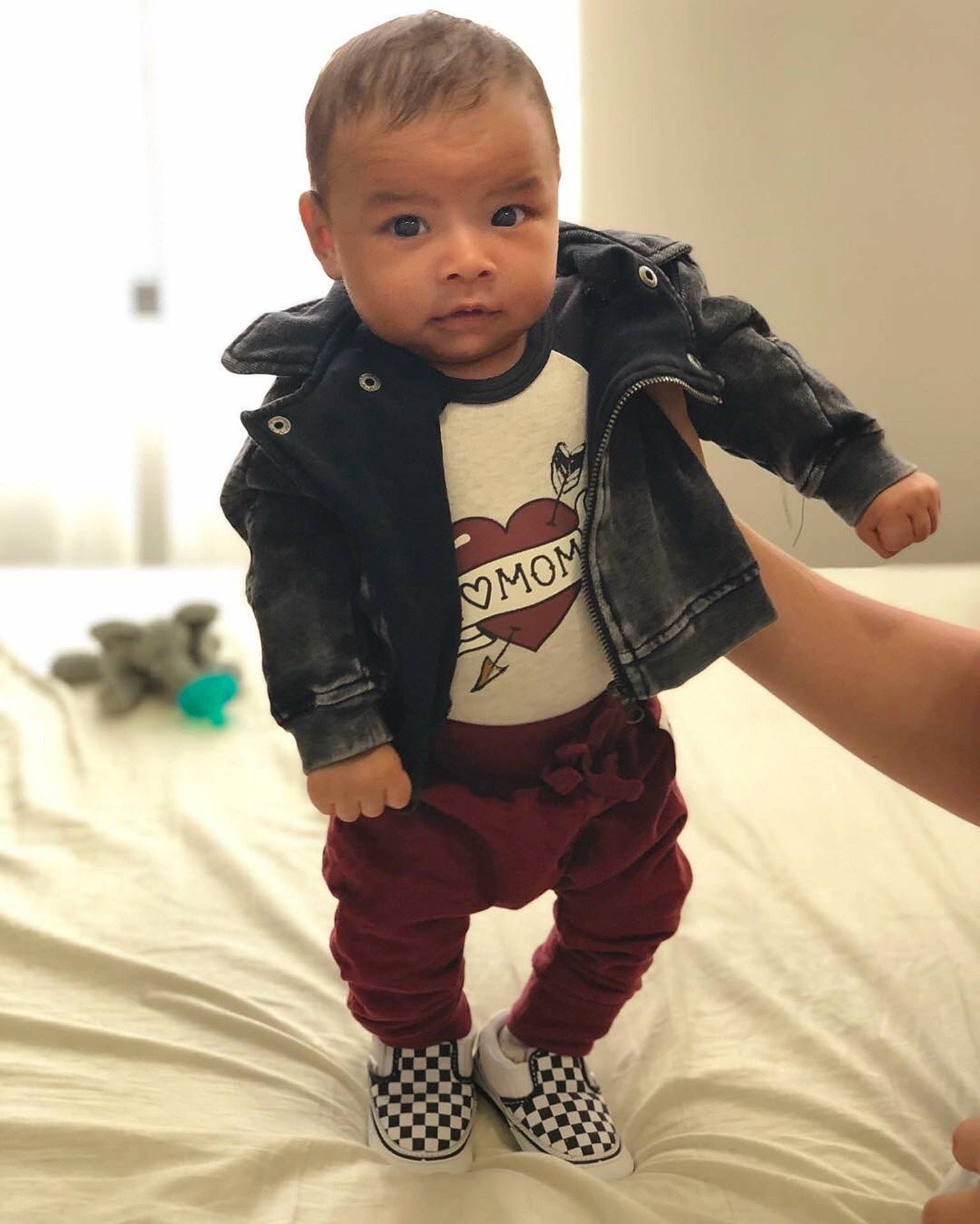Kyree is registered to the contest to win money with this photo: boy, child, cool, jacket, jeans, material, outerwear, person, product, sleeve, t_shirt, textile, toddler