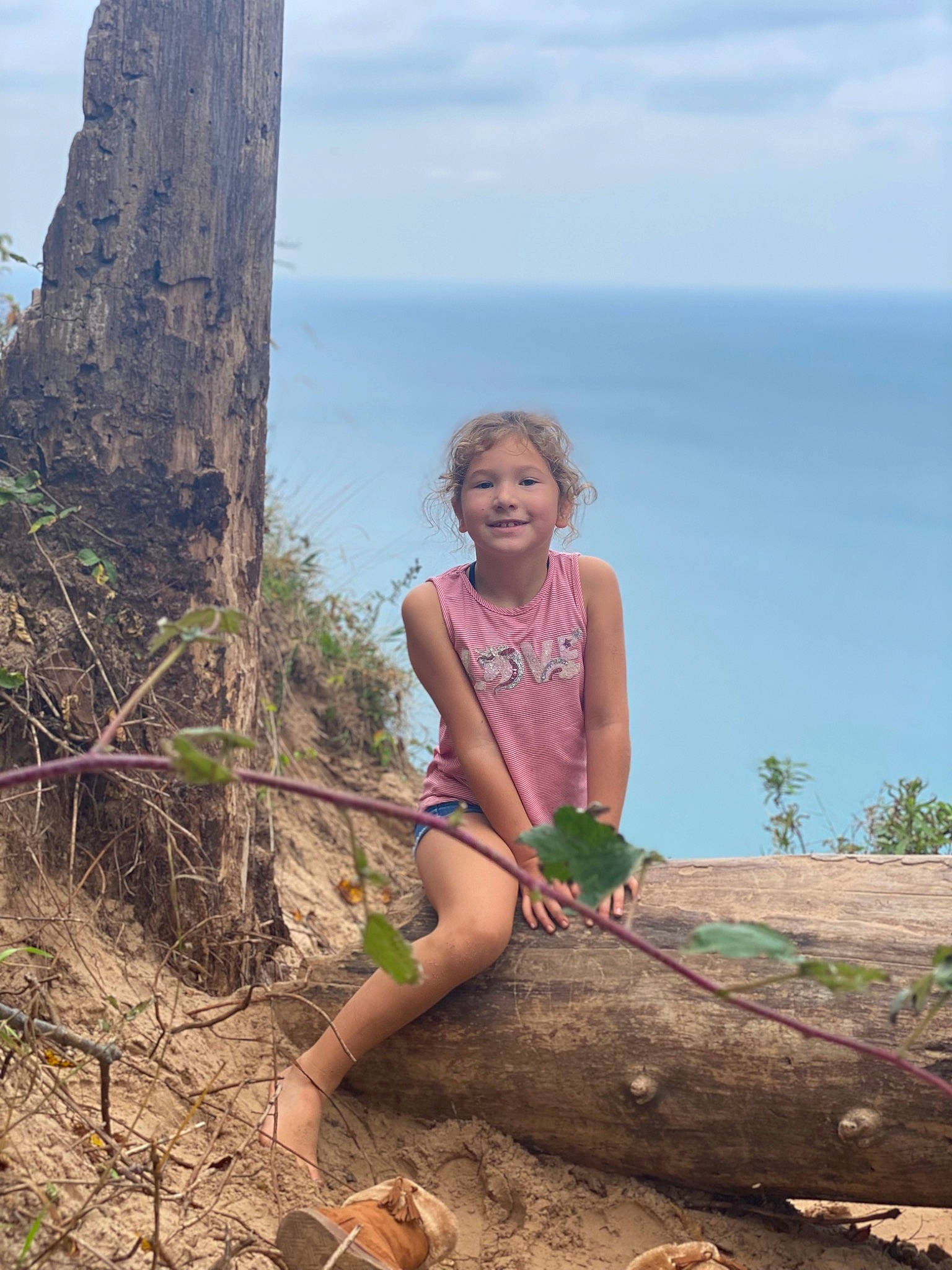 Cataleya is registered to the contest to win money with this photo: cloud, ecoregion, face, fun, grass, human_leg, joy, knee, landscape, leisure, nature, people_in_nature, person, plant, rock, sky, soil, summer, thigh, travel