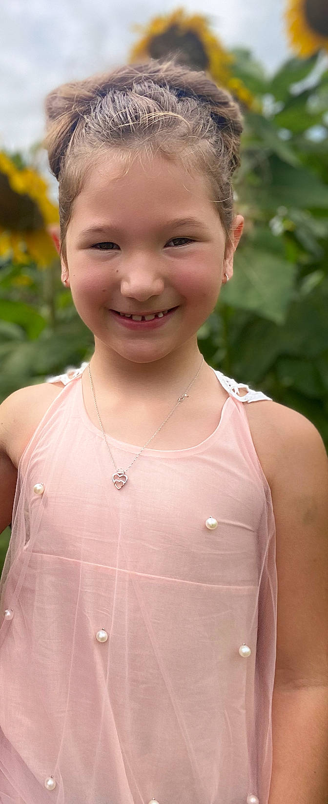 Cataleya is registered to the contest to win money with this photo: brown_hair, chest, child, chin, eye, facial_expression, flash_photography, grass, happy, iris, jewellery, joy, lip, neck, necklace, people_in_nature, person, pink, skin, smile