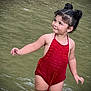 Valentina is registered to the contest to win money with this photo: child, toddler, water, swimsuit, red_clothing, hair_buns, smile, standing, outdoor, nature, playful, water_body, cute, portrait, young_child, summer, happy, person, skin, arm