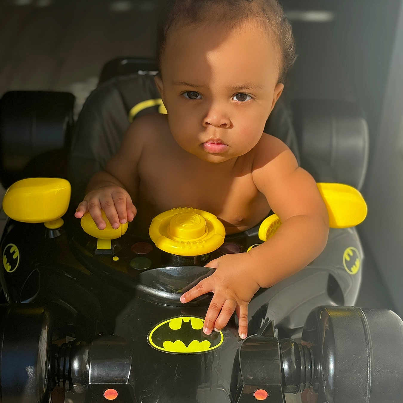 Keyshawn is registered to the contest to win money with this photo: arm, autoracing, baby, bodypart, buggy, car, car_interior, carseat, cream, dessert, driving, eating, face, finger, food, formulaone, grass, hand, happy, head