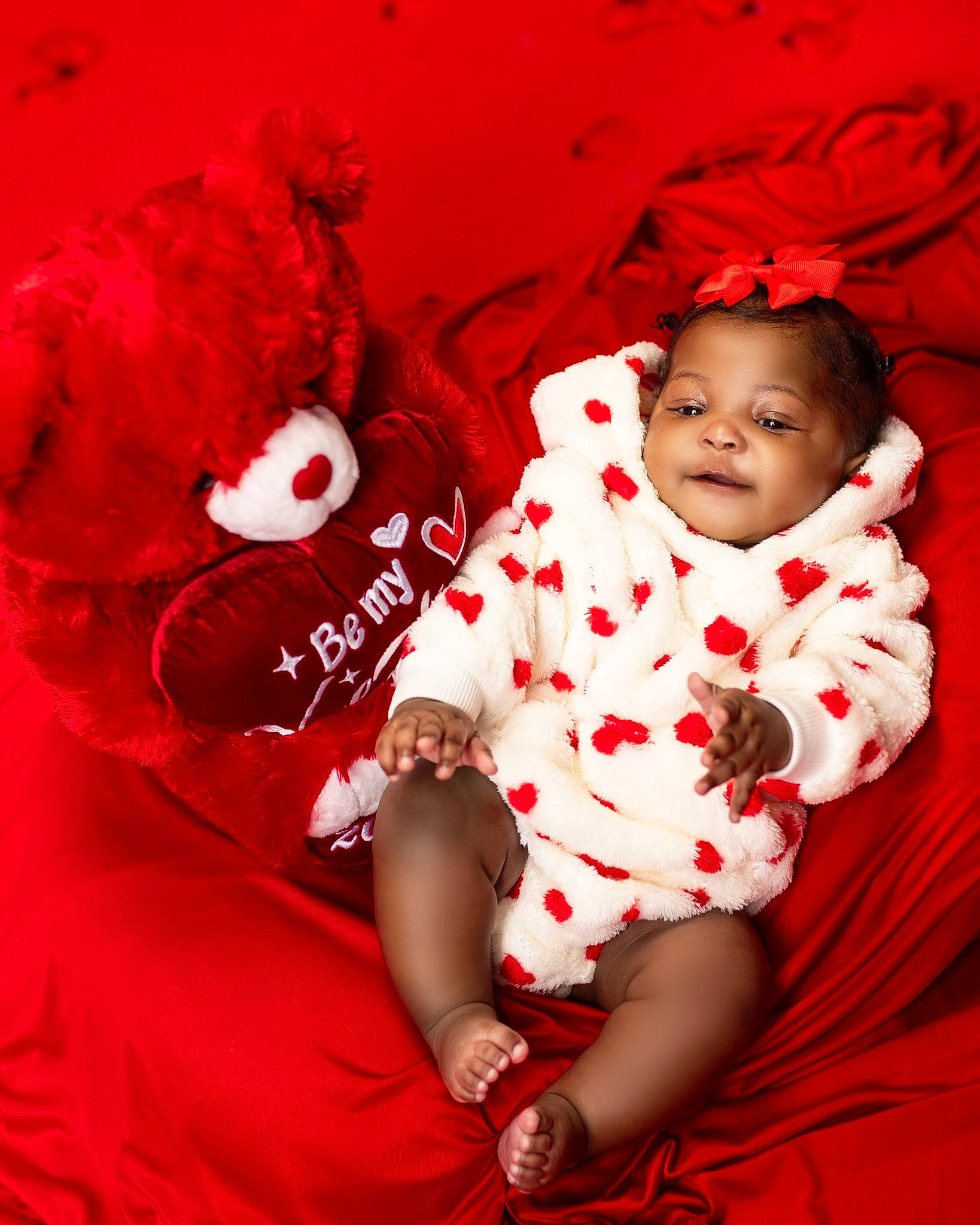 Ivy is registered to the contest to win money with this photo: baby, baby_toddler_clothing, carmine, child, comfort, flash_photography, font, gesture, happy, linens, magenta, pattern, person, petal, pink, red, sitting, sleeve, smile, t_shirt