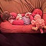 Gracelynn Ann Marie joined the competition — help win amazing prizes! baby, sleeping, adult_arm, mittens, socks, stuffed_animal, couch, blanket, cozy, infant, resting, comfort, soft_toy, human, indoor, closeup, peaceful, relaxation, toddler, person