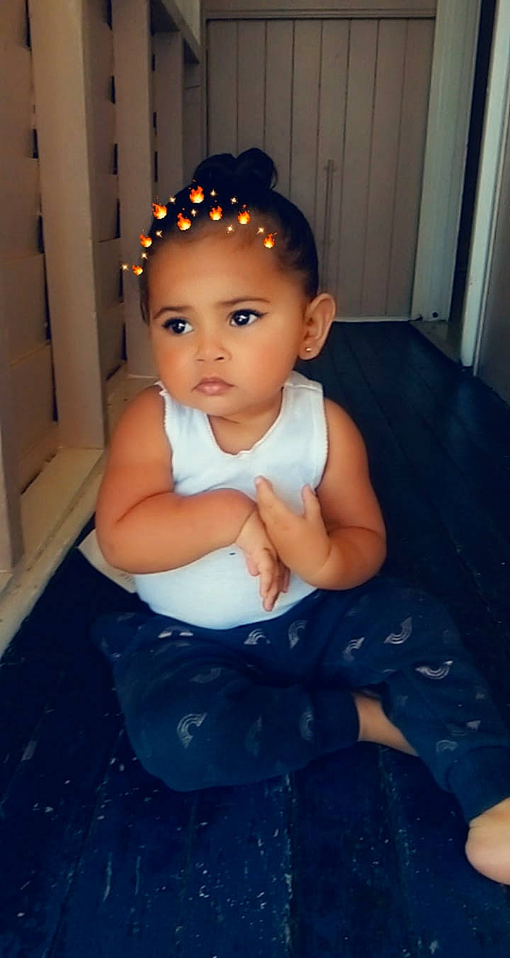 Alinta is registered to the contest to win money with this photo: arm, baby, beauty, cheek, child, chin, eye, face, forehead, fun, hair, hair_accessory, head, headband, lip, nose, person, sitting, skin, standing