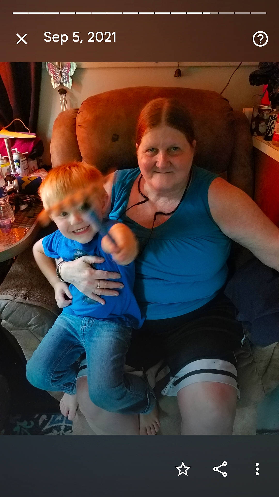 Derrick is registered to the contest to win money with this photo: comfort, electric_blue, event, eye, facial_expression, fun, happy, joy, knee, lap, leg, leisure, muscle, person, shorts, sitting, smile, t_shirt, thigh, toddler